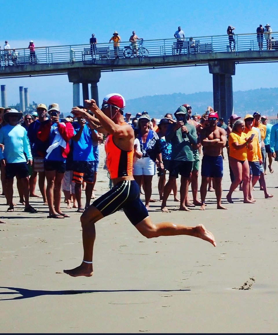 Tom O'Neill competing on the beach at the US National Lifeguard Championships